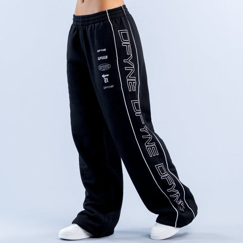 Black wide-leg joggers with elastic waistband and white side graphic print