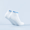White ankle socks with blue logo on cuff