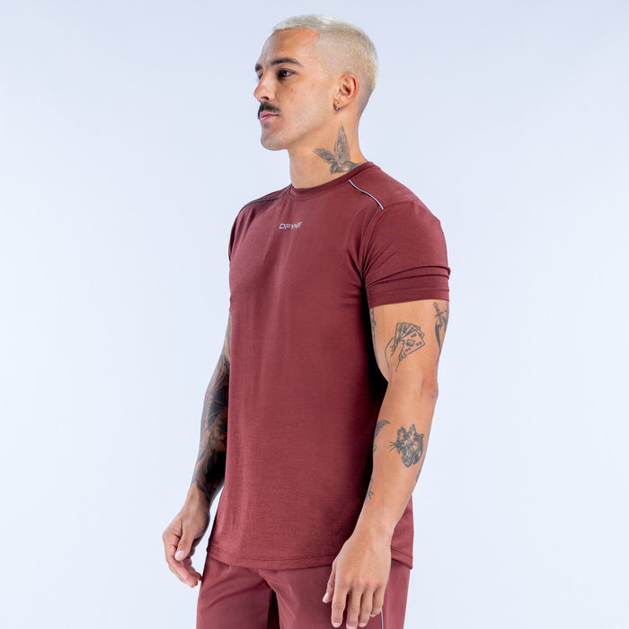 Maroon active top with fitted cut, crew neck, short sleeves, side view