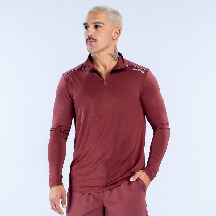 Maroon quarter-zip long-sleeve athletic pullover with chest logo and standing collar
