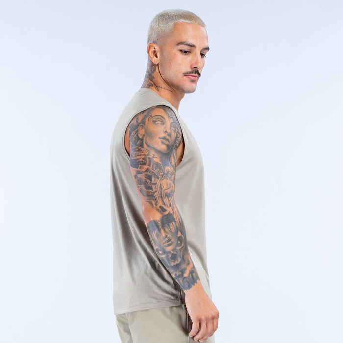 Beige sleeveless crew-neck tank top with side seam and relaxed fit