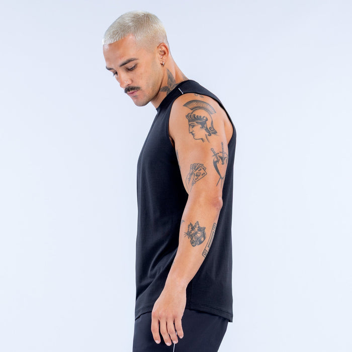 Black sleeveless tank side view with straight hem and DRYLINE logo near collar