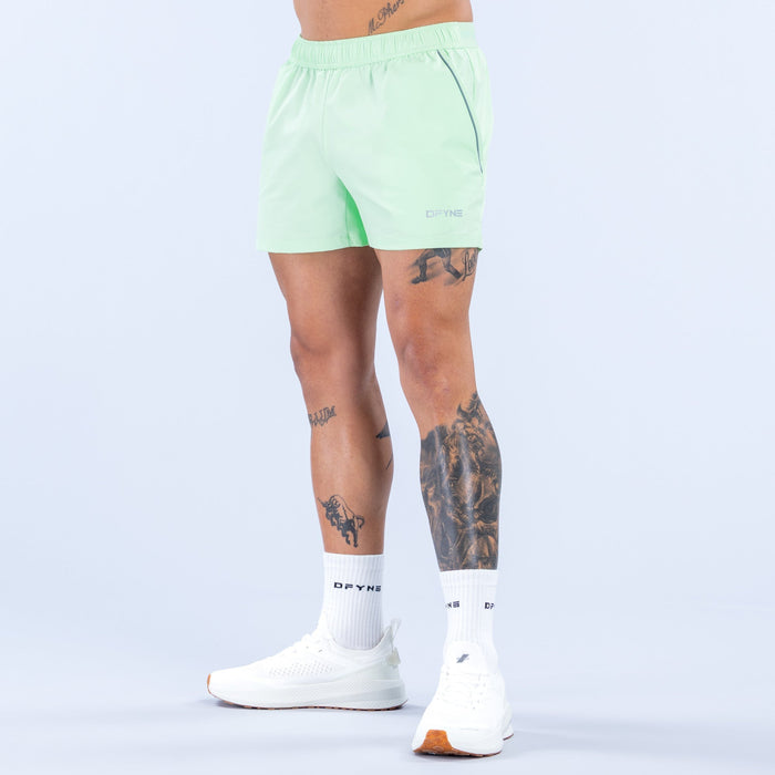 Mint green 4-inch training shorts with elastic waistband and drawstring