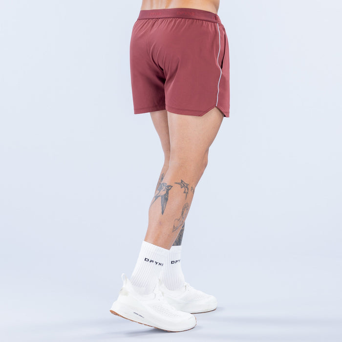 Burgundy 4-inch training shorts, back view, elastic waistband and side piping