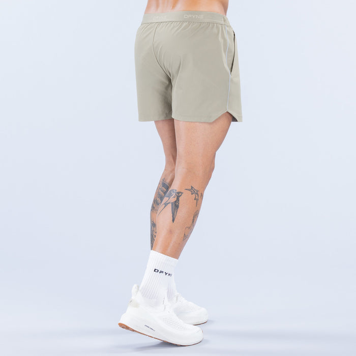 Olive 4-inch training shorts showing back seam, elastic waistband, and logo