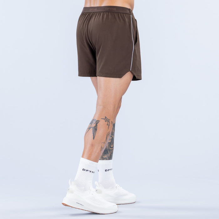 Men's dark brown 4-inch training shorts with elastic waistband, back view