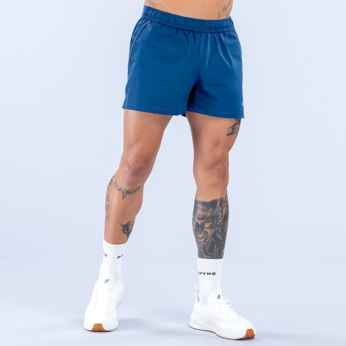 Men's blue training shorts with elastic waistband and side logo