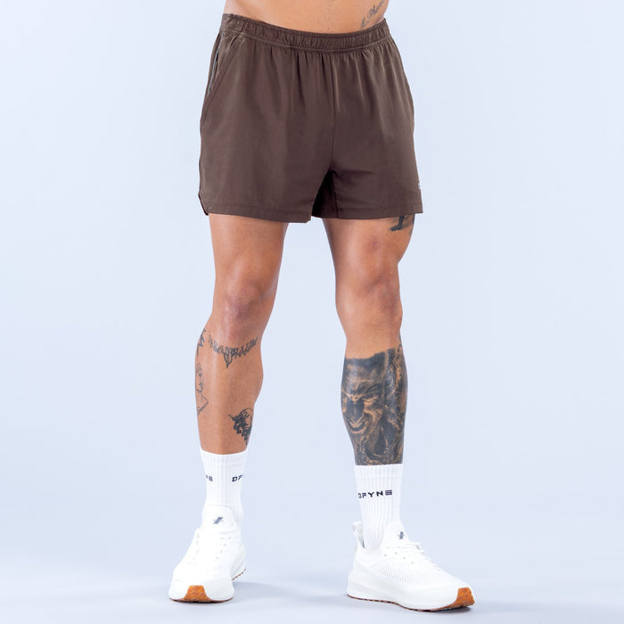 Men's dark brown 4-inch training shorts with elastic waistband, front view