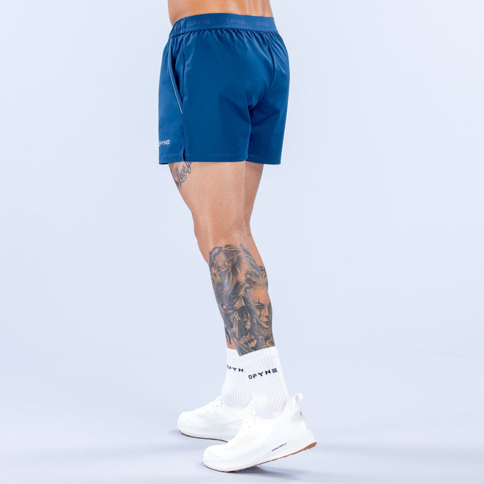 Men's blue training shorts with elastic waistband and back logo detail