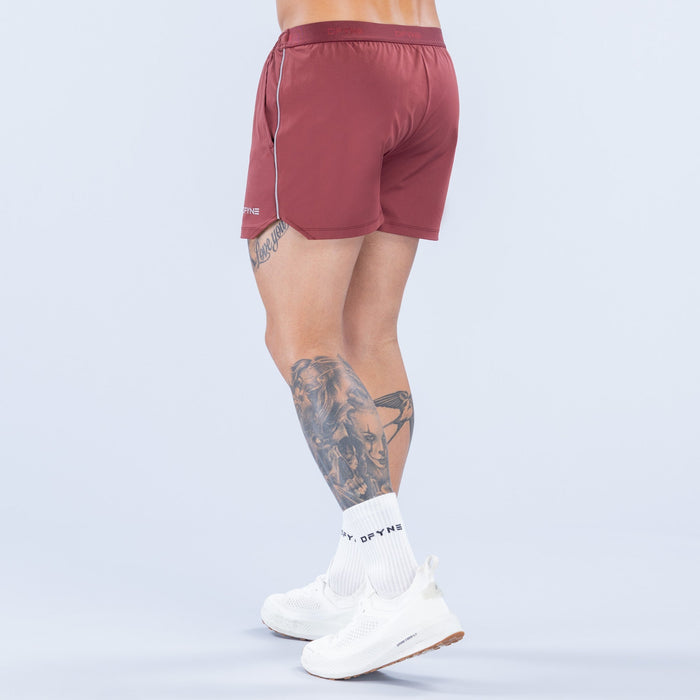 Burgundy 4-inch training shorts, rear view, elastic waistband and side piping