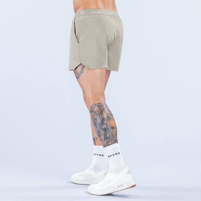 Olive 4-inch training shorts side view with elastic waistband and back seam