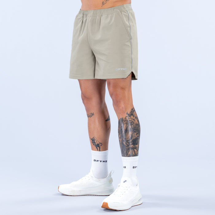 Olive 6-inch training shorts with elastic waistband and side seam accents