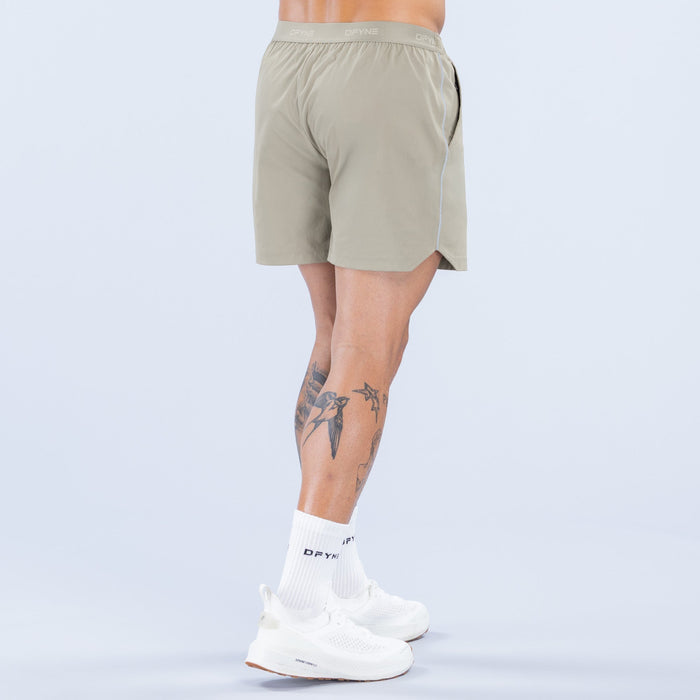 Olive 6-inch training shorts, elastic waistband and relaxed fit
