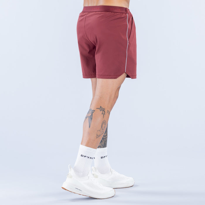 Maroon training shorts back view with reflective piping and side logo