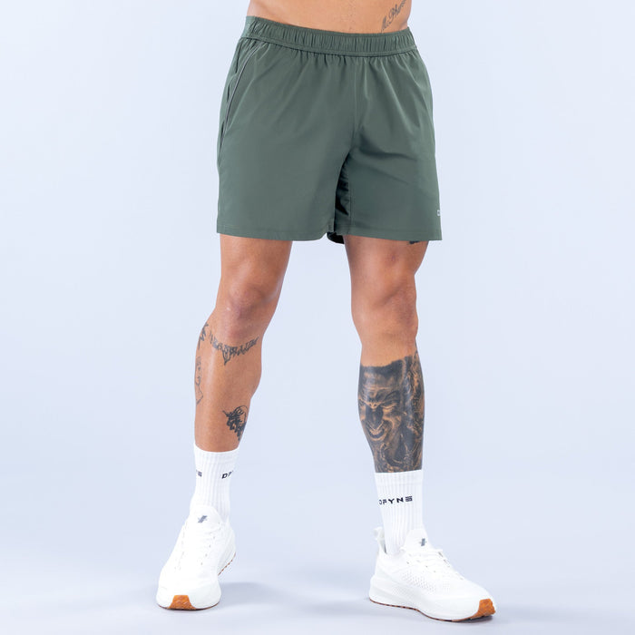 Dark green 6-inch training shorts with elastic waistband and small logo at hem.