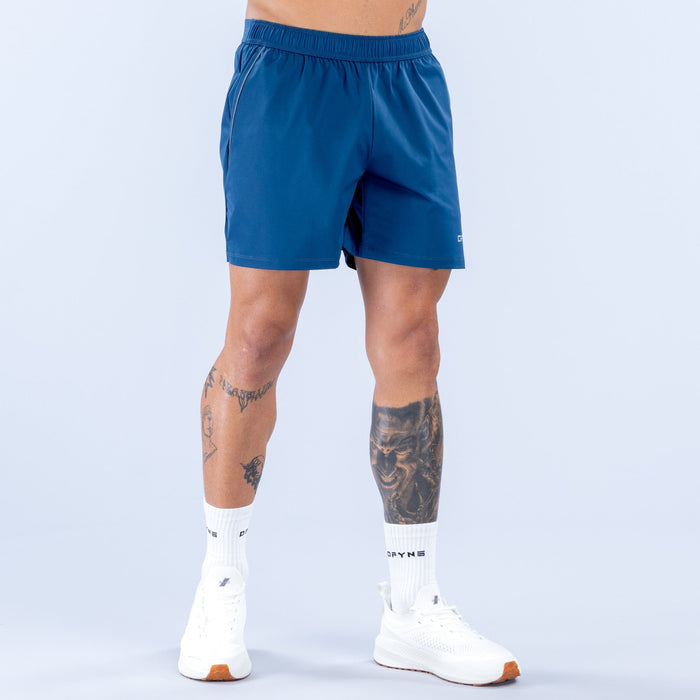 Men's blue training shorts with elastic waistband and small side logo, 6 in inseam