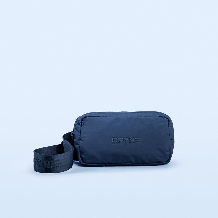 Navy nylon crossbody bag with DPYNE logo, rounded zip top and adjustable strap