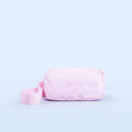 Pink crossbody bag with front logo, zipper top, and adjustable webbing strap
