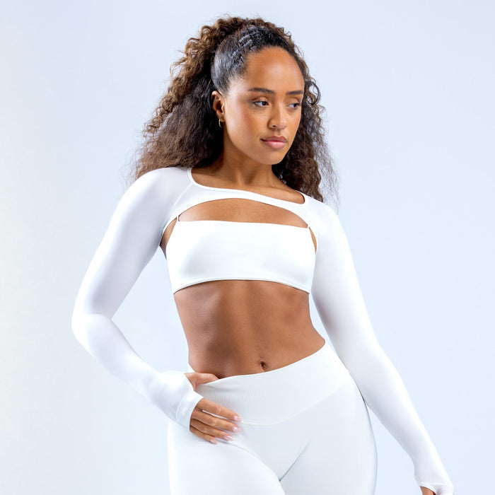 White long-sleeve shrug with center chest cutout and fitted cropped length