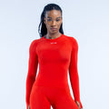 Red long-sleeve compression top with crew neck and small chest logo