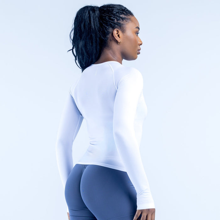 White long-sleeve crew neck top, side view