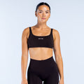 Black scoop back sports bra with scoop neckline and DPNY logo on front