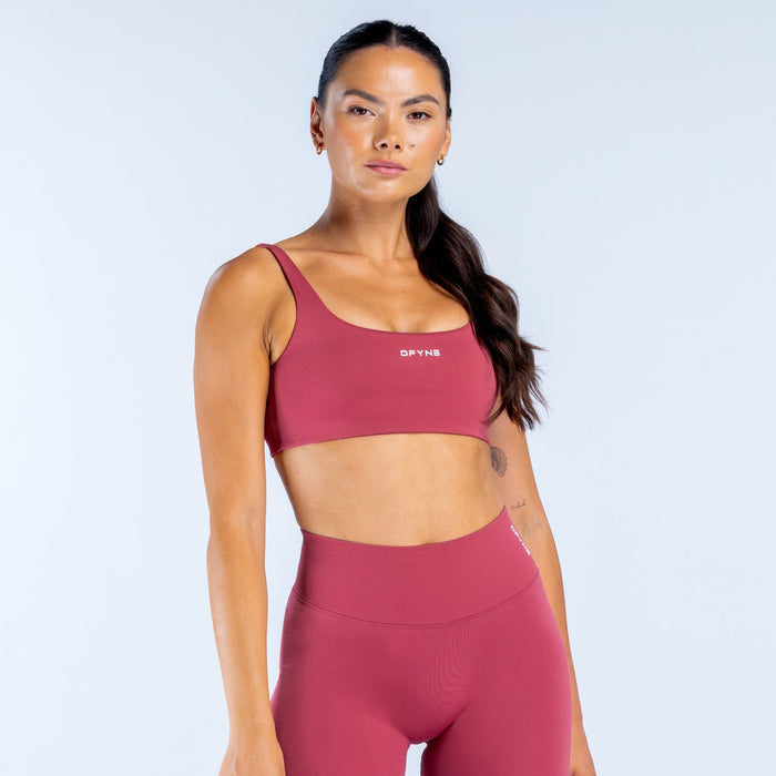 Maroon scoop-back sports bra with wide band hem