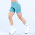 Women’s teal 4.5-inch athletic shorts, mid-rise, snug fit