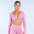 Pink twist-front long-sleeve crop top with V neckline