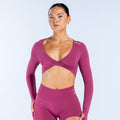 Twist-front long sleeve athletic top in deep plum with V-neck and wrap crossover
