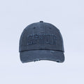 Distressed denim baseball cap with embroidered logo and frayed brim