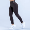 Black full-length performance leggings with snug fit and visible waistband logo