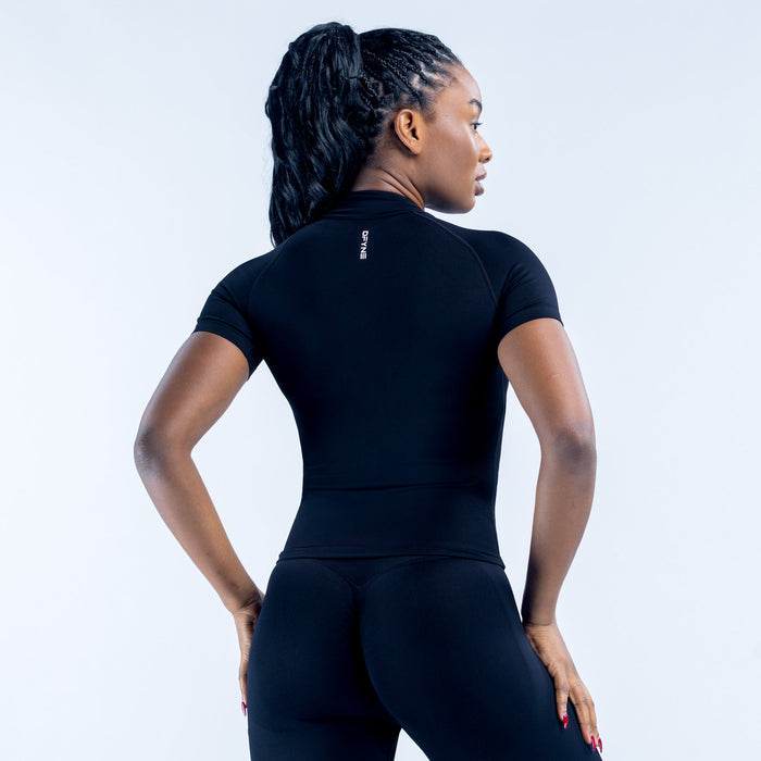 Black short-sleeve zip-up athletic top with mock neck, back view