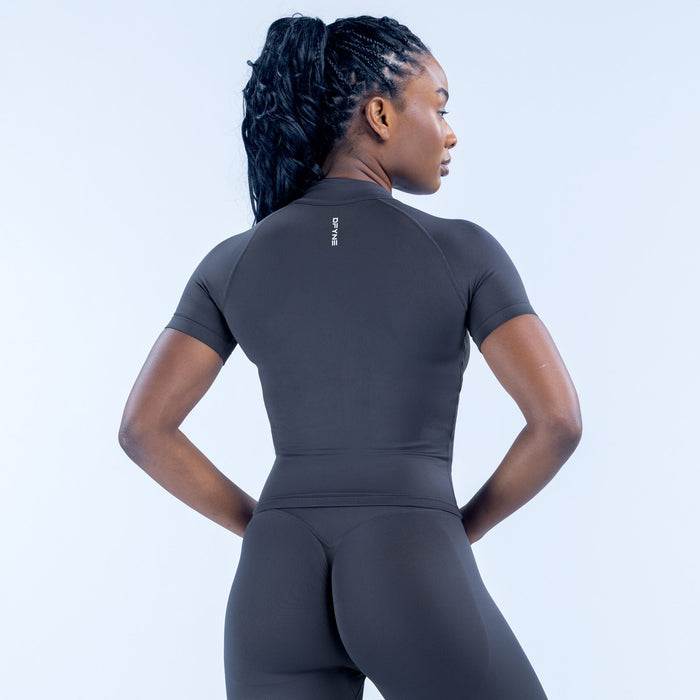 Black short-sleeve zip-up athletic top, back view with full-length zipper
