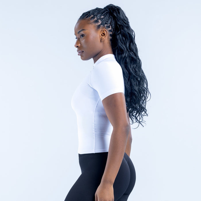 White short-sleeve zip-up athletic top, fitted side profile with front zipper