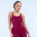 Burgundy strappy sports top with scoop neckline and racerback fit