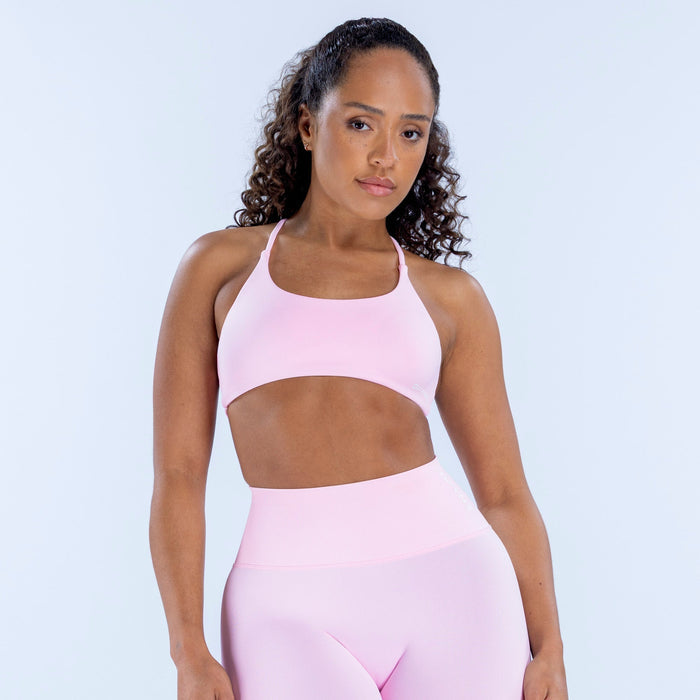 Light pink twist-back bra with scoop neckline and cutout front