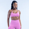 Pink sports bra with scoop front and thin adjustable straps