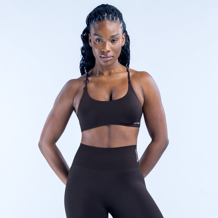 Black sports bra with wide straps and supportive twisted-back design