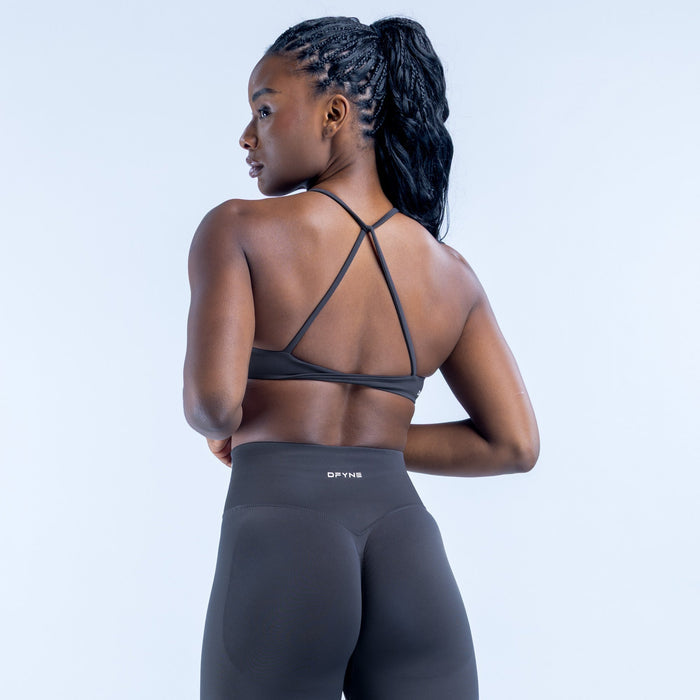 Dark sports bra with crisscross twisted open-back straps