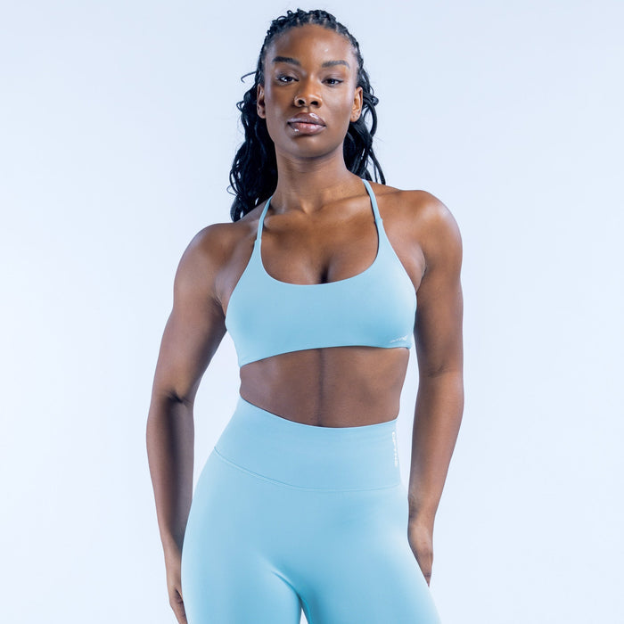Light blue sports bra, wide straps and fitted bust band