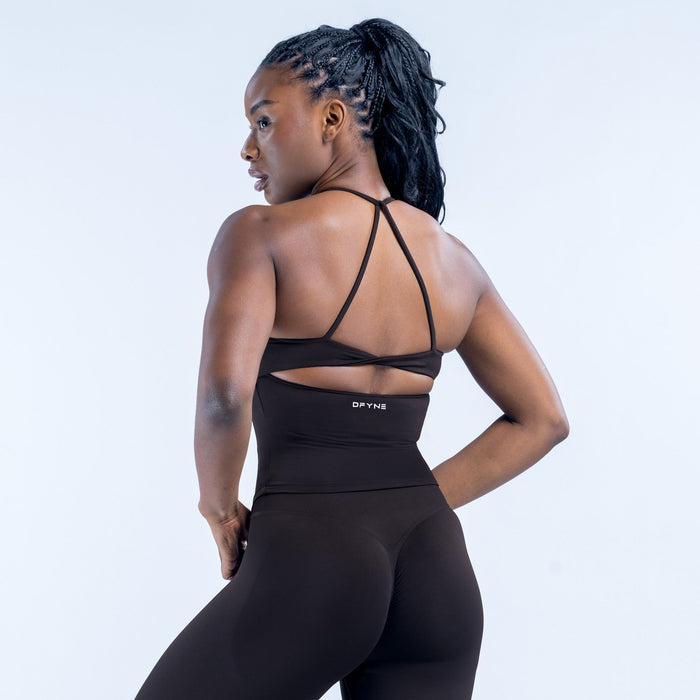 Black twist-back sports top with open back and crisscross strap detail