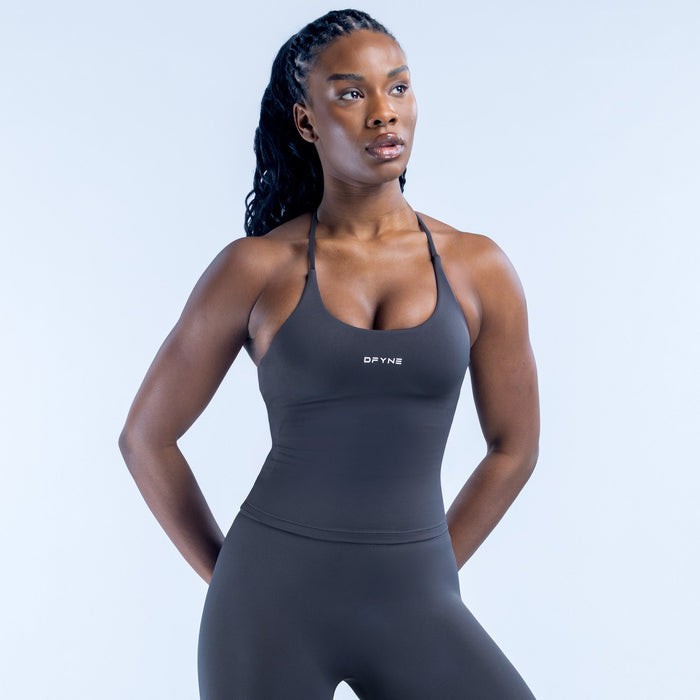 Twist-back athletic top with halter straps, black fabric, DRYNE logo