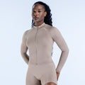 Women's taupe zip-front athletic jumpsuit with long sleeves and high collar