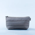 Padded zip pouch in dark gray with front seam and small logo patch