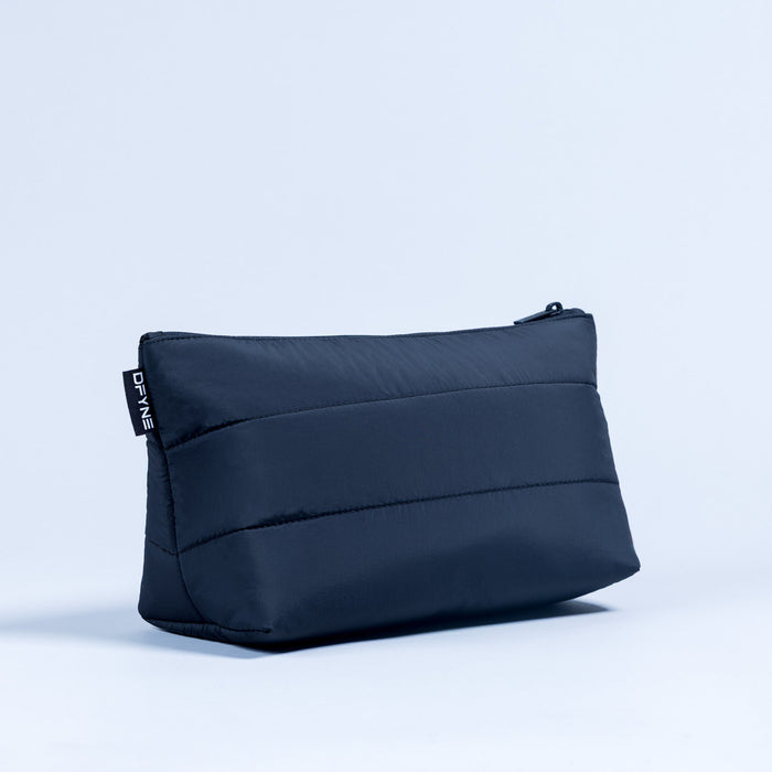 Dark navy quilted pouch with top zipper, rectangular shape and stitched seams