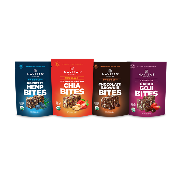 Four Navitas Organics Superfood+ BITES packages on a white background