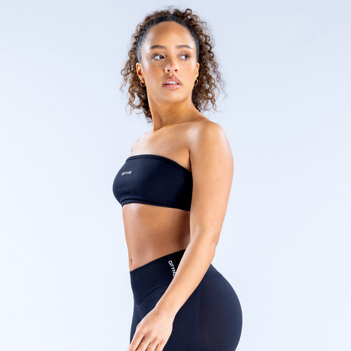Black bandeau sports bra with strapless front and supportive straight neckline