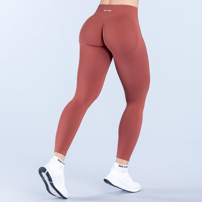 Maroon impact leggings, back view with contoured waistband and seamless fit