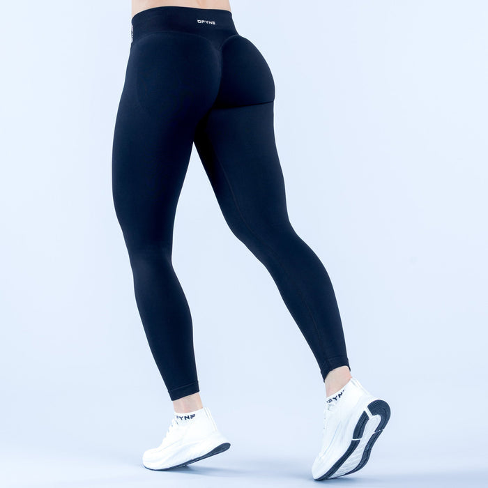 Black high-waist leggings, side view with ankle-length fit and visible logo band